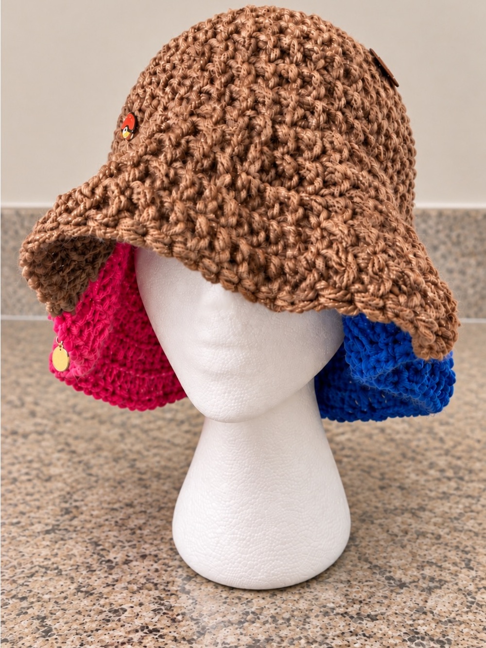 Tan pink and blue ruffle hat
